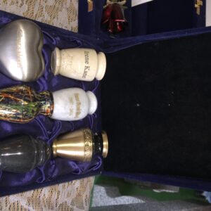 A box of four different urns in it.