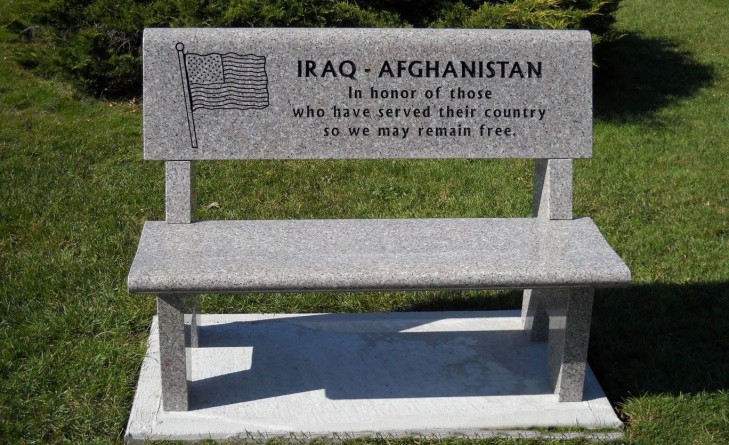 A bench with the words iraq afghanistan in it.