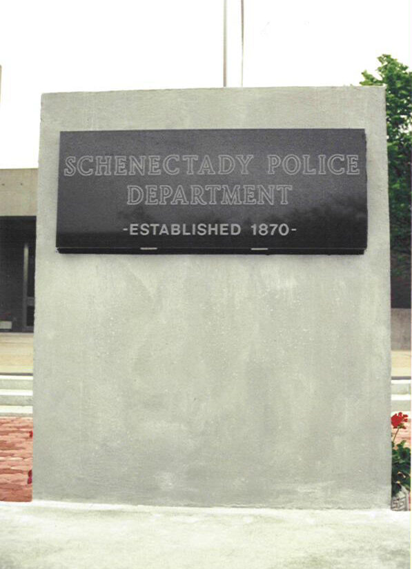 A sign that says schenectady police department established 1 8 7 0.