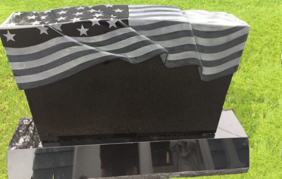 A computer generated image of an american flag draped over the top of a grave.