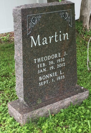 A grave marker for theodore martin and bonnie l.